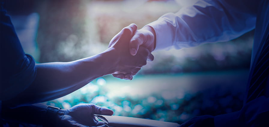 Client shaking hands on a successful loan agreement facilitated by FAB Loan Calculator.