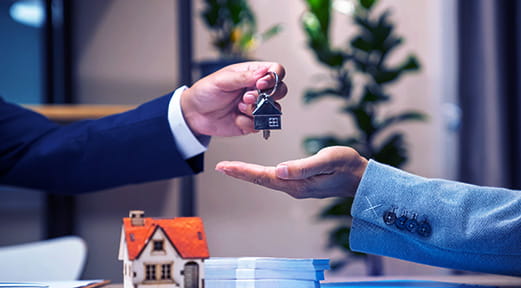 Resident receiving keys to their new home with FAB Home Loan for Residents in UAE.