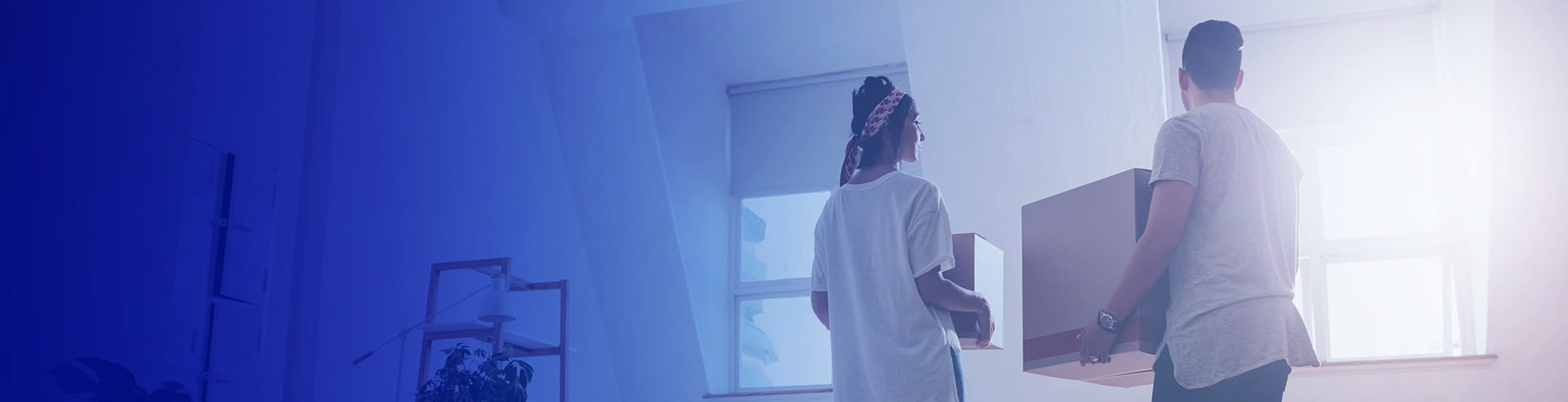 Man unpacking boxes in his new home, with a FAB first-time homeowner mortgage